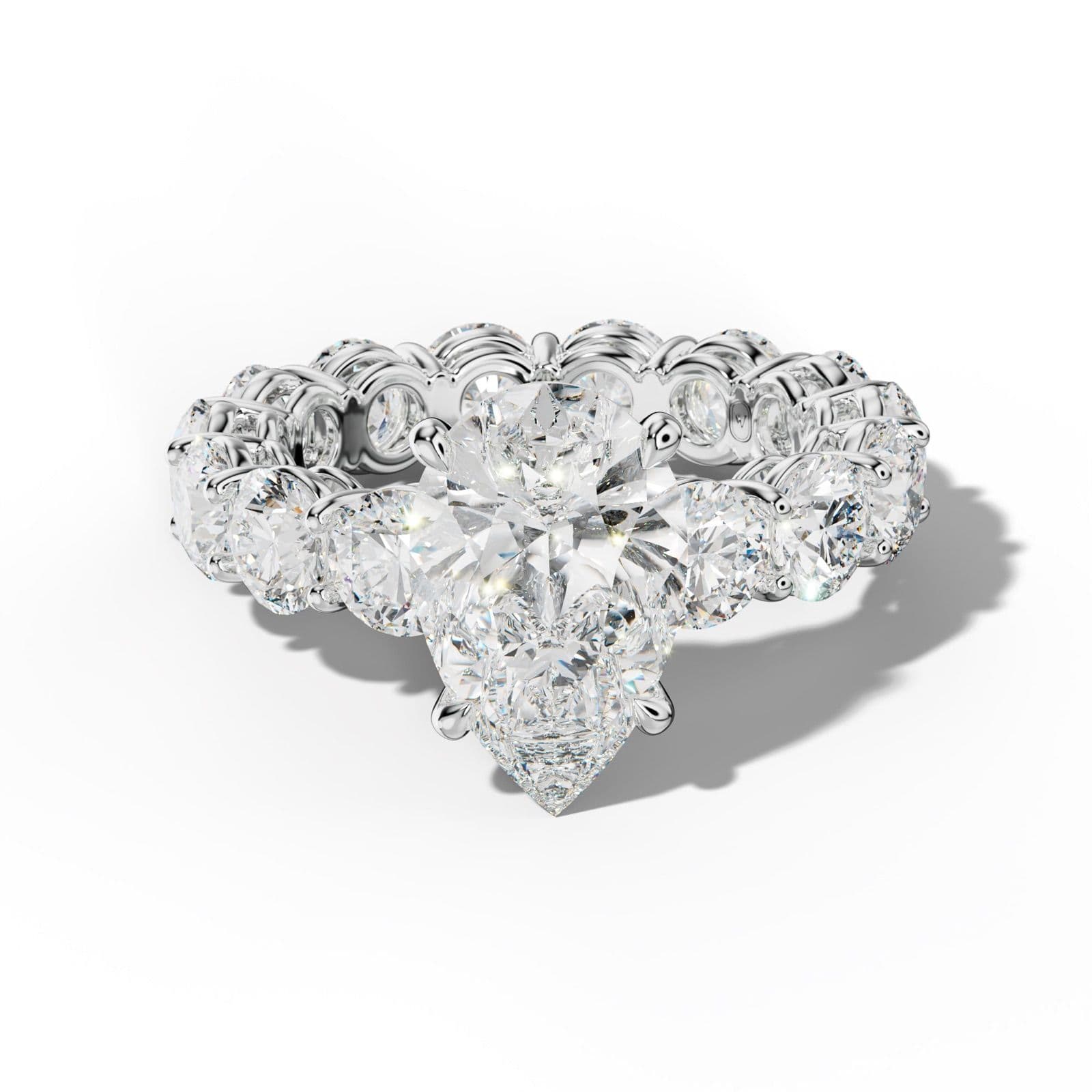 Maddie Pear Shape Engagement Ring With Round Side Stones